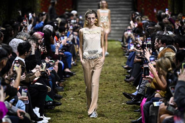 A model presents a creation for Miu Miu for the Women's Ready to Wear Fall/Winter 2026-2027 collection fashion show as part of the Paris Women Fashion Week, in Paris, on March 10, 2026. (Photo by JULIEN DE ROSA / AFP)