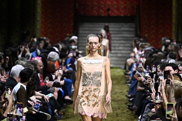 A model presents a creation for Miu Miu for the Women's Ready to Wear Fall/Winter 2026-2027 collection fashion show as part of the Paris Women Fashion Week, in Paris, on March 10, 2026. (Photo by JULIEN DE ROSA / AFP)