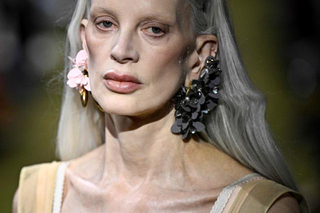 US model Kristen McMenamy presents a creation for Miu Miu for the Women's Ready to Wear Fall/Winter 2026-2027 collection fashion show as part of the Paris Women Fashion Week, in Paris, on March 10, 2026. (Photo by JULIEN DE ROSA / AFP)