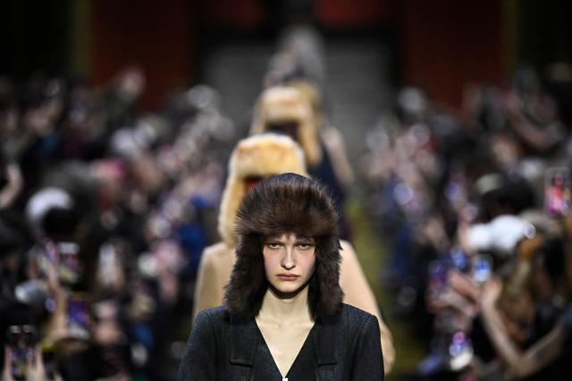 A model presents a creation for Miu Miu for the Women's Ready to Wear Fall/Winter 2026-2027 collection fashion show as part of the Paris Women Fashion Week, in Paris, on March 10, 2026. (Photo by JULIEN DE ROSA / AFP)