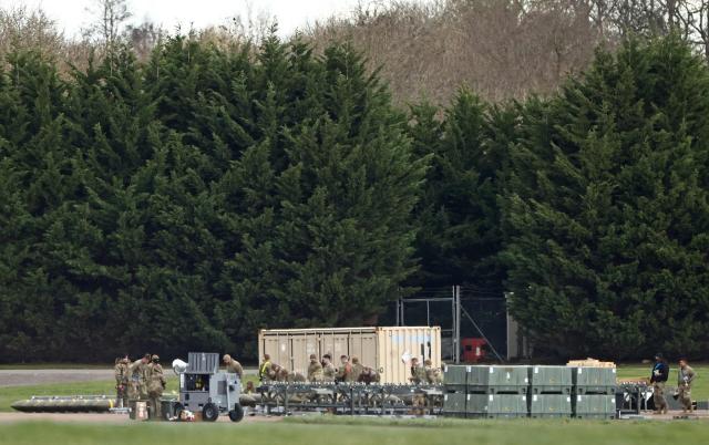 Members of the US Air Force (USAF) prepare munitions at RAF Fairford in south-west England on March 10, 2026, after USAF B-1 Lancer bomber jets and Air Force Boeing B-52 Stratofortress bombers landed at the RAF base. Fairford is one of two bases, along with the Diego Garcia facility in the Indian Ocean, that the UK has given the US permission to use for "specific defensive operations into Iran" to destroy Iranian missiles at source, the British defence minister said in a statement. (Photo by Henry NICHOLLS / AFP)