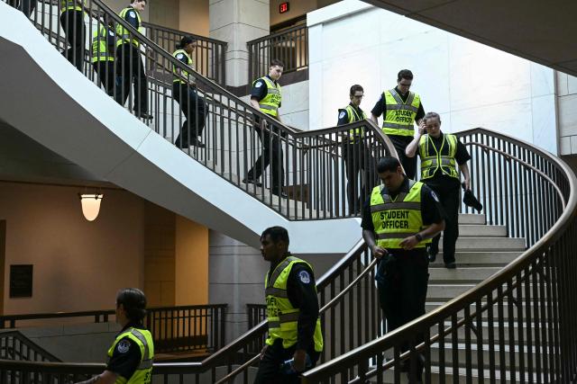 US Capitol Police Students Officers walk through the US Capitol in Washington, DC, on March 10, 2026. (Photo by Brendan SMIALOWSKI / AFP)