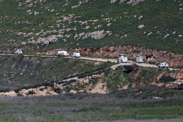 This picture taken from Israel's northern border with Lebanon, shows United Nations Interim Force In Lebanon (UNIFIL) vehicles on southern Lebanon near the border with northern Israel on March 10, 2026. A strike hit Beirut's southern suburbs on March 10, state media reported, after the Israeli military renewed its warning for people to evacuate the area. Israel's military began striking southern Lebanon on March 4 after issuing a call to evacuate all areas south of the country's Litani river. Lebanon was drawn into the Middle East war when Iran-backed militant group Hezbollah attacked Israel in response to the killing of Iranian supreme leader during US-Israeli strikes. (Photo by AHMAD GHARABLI / AFP) / Attention editors: AFP covers the war in the Middle East through its extensive regional network, including bureaus in Tehran, Jerusalem and several neighboring countries.Since the start of the conflict, journalists have been working under increasingly restrictive conditions. Authorities in several countries have limited reporters movements, photo and live video coverage from sensitive locations. Some governments and armed groups have banned images of missile or drone strikes and other security-related sites. / 