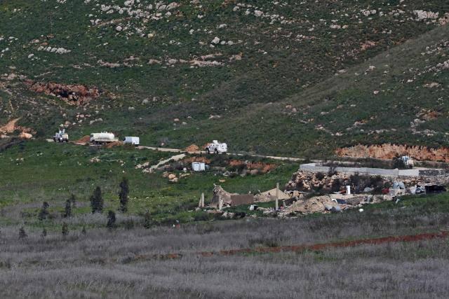 This picture taken from Israel's northern border with Lebanon, shows United Nations Interim Force In Lebanon (UNIFIL) vehicles on southern Lebanon near the border with northern Israel on March 10, 2026. A strike hit Beirut's southern suburbs on March 10, state media reported, after the Israeli military renewed its warning for people to evacuate the area. Israel's military began striking southern Lebanon on March 4 after issuing a call to evacuate all areas south of the country's Litani river. Lebanon was drawn into the Middle East war when Iran-backed militant group Hezbollah attacked Israel in response to the killing of Iranian supreme leader during US-Israeli strikes. (Photo by AHMAD GHARABLI / AFP) / Attention editors: AFP covers the war in the Middle East through its extensive regional network, including bureaus in Tehran, Jerusalem and several neighboring countries.Since the start of the conflict, journalists have been working under increasingly restrictive conditions. Authorities in several countries have limited reporters movements, photo and live video coverage from sensitive locations. Some governments and armed groups have banned images of missile or drone strikes and other security-related sites. / 