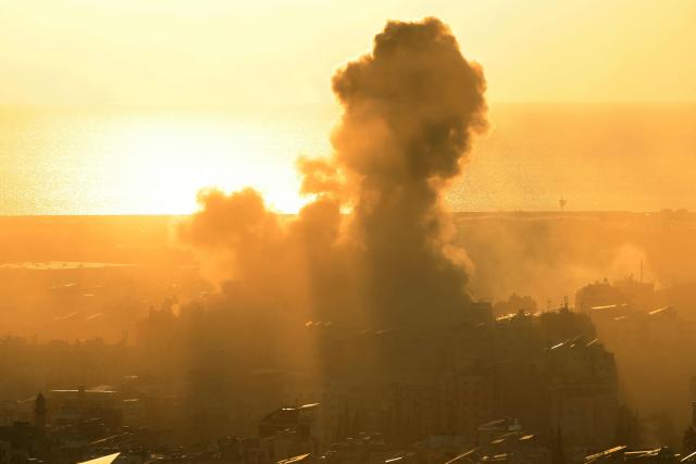 TOPSHOT - Smoke rises from the site of an Israeli airstrike that targeted an area in Beirut's southern suburbs on March 10, 2026. Lebanon was drawn into the Middle East war last week when Iran-backed militant group Hezbollah attacked Israel in response to the killing of Iranian supreme leader Ayatollah Ali Khamenei during US-Israeli strikes. (Photo by Ibrahim AMRO / AFP) / Attention editors: AFP covers the war in the Middle East through its extensive regional network, including bureaus in Tehran, Jerusalem and several neighboring countries.Since the start of the conflict, journalists have been working under increasingly restrictive conditions. Authorities in several countries have limited reporters movements, photo and live video coverage from sensitive locations. Some governments and armed groups have banned images of missile or drone strikes and other security-related sites. / 