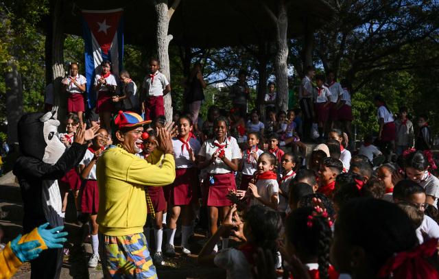 Students take part in a cultural activity in Victor Hugo Park in Havana on March 10, 2026. (Photo by YAMIL LAGE / AFP)