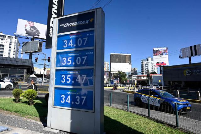 The new fuel prices are seen on a board at a gas station in Guatemala City on March 10, 2026. The prices of petroleum derivatives soared in Guatemala due to the war in the Middle East. (Photo by JOHAN ORDONEZ / AFP)