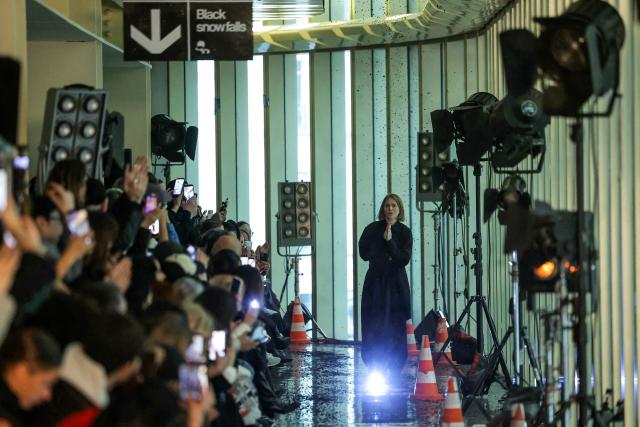 Ukrainian fashion designer Lilia Litkovska acknowledges the audience at the end of the Litkovska Women's Ready to Wear Fall/Winter 2026-2027 collection fashion show as part of the Paris Women Fashion Week, in Paris, on March 10, 2026. (Photo by Thomas SAMSON / AFP)