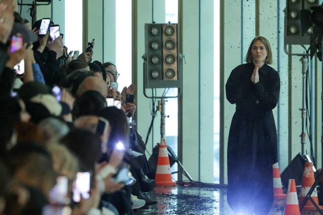 Ukrainian fashion designer Lilia Litkovska acknowledges the audience at the end of the Litkovska Women's Ready to Wear Fall/Winter 2026-2027 collection fashion show as part of the Paris Women Fashion Week, in Paris, on March 10, 2026. (Photo by Thomas SAMSON / AFP)