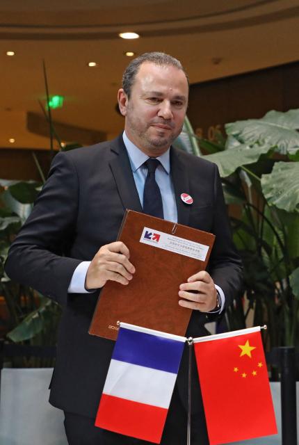 (FILES) Christophe Lecourtier, president of Business France, poses after signing an agreement during a meeting with business leaders and a visit by French at start-up incubator Soho3Q in Beijing on January 9, 2018. French President plans to appoint Christophe Lecourtier, currently France's ambassador to Morocco, as head of the Agence Francaise de Developpement ('French Development Agency (AFD'), subject to the approval of the relevant parliamentary committees and a favourable opinion from the High Authority for Transparency in Public Life, the Elysee announced on March 10, 2026. (Photo by ludovic MARIN / AFP)