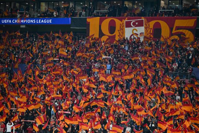 Liverpool supporters cheer their team  during the UEFA Champions League round of 16 first leg football match between Galatasaray SK and Liverpool FC at the Ali Sami Yen Sports Complex in Istanbul on March 10, 2026. (Photo by YASIN AKGUL / AFP)