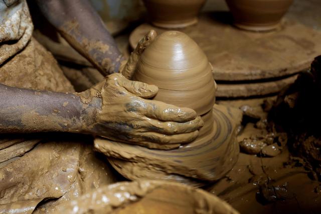 An artisan works on traditional pottery in a factory in Rabat on March 10, 2026. (Photo by Abdel Majid BZIOUAT / AFP)