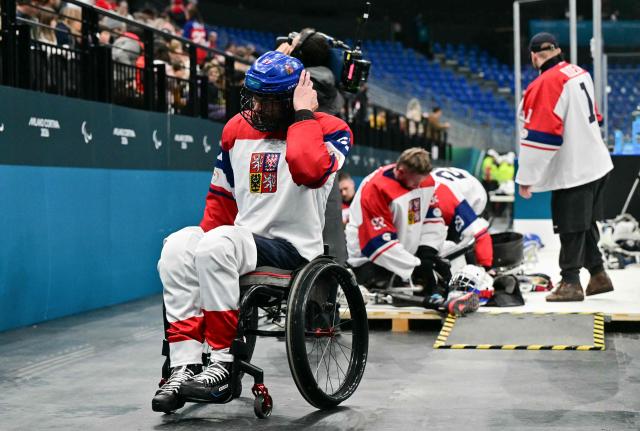 Czech Republic Pavel Dolezal leaves the rink during the half time of the ice hockey match between Czech Republic and Canada at the Milano Cortina 2026 Paralympic Winter Games in Milan on March 10, 2026. (Photo by Stefano RELLANDINI / AFP)