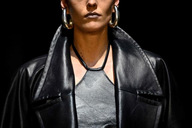 A model presents earoings for Situationist for the Women's Ready to Wear Fall/Winter 2026-2027 collection fashion show as part of the Paris Women Fashion Week, in Paris, on March 10, 2026. (Photo by JULIEN DE ROSA / AFP)