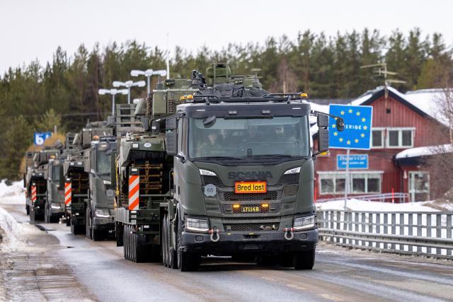 Swedish Leopard main battle tanks are transported across the border between Finland and Sweden to take part in the arctic military exercise Cold Response 26 in Pello, northern Finland, on March 10, 2026. Cold Response 26, led by Norway, brings 25,000 soldiers from 14 countries to Northern parts of Finland, Norway and Sweden to take part in the exercise which is part of NATO's enhanced presence, Arctic Sentry. The field training exercise in Finland involves soldiers from Finland, Sweden, the United States, France, Italy and the United Kingdom. (Photo by Jarno Vuorinen / various sources / AFP) / Finland OUT