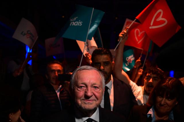 President of Business software publisher Cegid and Vice-President of French Football (FFF) Jean-Michel Aulas (C) looks on as he attends a campaign rally for his candidacy in the Lyon municipal elections, in Lyon, central-eastern France, on March 10, 2026. (Photo by OLIVIER CHASSIGNOLE / AFP)