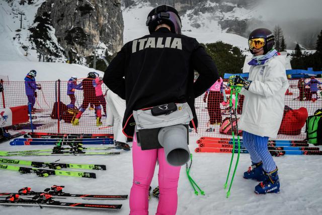 A guide and the athlete prepare for the alpine skiing combined event during the Milano Cortina 2026 Paralympic Winter Games in Cortina d’Ampezzo on March 10, 2026. (Photo by JEFF PACHOUD / AFP)