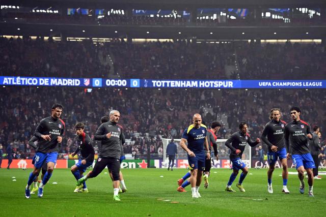 Atletico Madrid's players warm up before the UEFA Champions League last 16 first leg football match between Club Atletico de Madrid and Tottenham Hotspur at Metropolitano Stadium in Madrid on March 10, 2026. (Photo by Javier SORIANO / AFP)