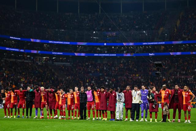 Galatasaray's players celebrate after winning the UEFA Champions League round of 16 first leg football match between Galatasaray SK and Liverpool FC at the Ali Sami Yen Sports Complex in Istanbul on March 10, 2026. (Photo by YASIN AKGUL / AFP)