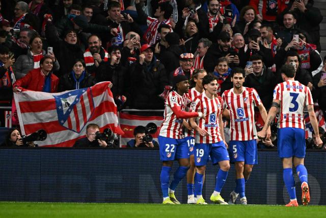 Atletico Madrid's Argentine forward #19 Julian Alvarez (2L) celebrates with teammates scoring his team's third goal during the UEFA Champions League last 16 first leg football match between Club Atletico de Madrid and Tottenham Hotspur at Metropolitano Stadium in Madrid on March 10, 2026. (Photo by Javier SORIANO / AFP)