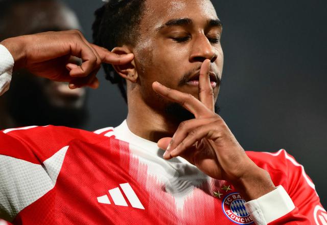 Bayern Munich's French midfielder #17 Michael Olise celebrates scoring his team's second goal with teammates during the UEFA Champions League last 16, first leg football match between Atalanta and Bayern Munich at the Gewiss stadium in Bergamo, on March 10, 2026. (Photo by Marco BERTORELLO / AFP)