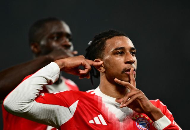 Bayern Munich's French midfielder #17 Michael Olise celebrates scoring his team's second goal with teammates during the UEFA Champions League last 16, first leg football match between Atalanta and Bayern Munich at the Gewiss stadium in Bergamo, on March 10, 2026. (Photo by Marco BERTORELLO / AFP)
