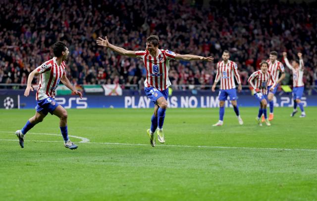 Atletico Madrid's Spanish defender #24 Robin Le Normand (2L) celebrates scoring his team's fourth goal during the UEFA Champions League last 16 first leg football match between Club Atletico de Madrid and Tottenham Hotspur at Metropolitano Stadium in Madrid on March 10, 2026. (Photo by Thomas COEX / AFP)