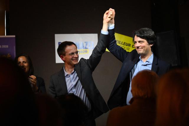 Ensemble centre-right party's mayoral candidate for Paris Pierre-Yves Bournazel (L) encourages Paris mayoral candidate and center-right head of the list for the 14th district Felix de Vidas (R) during a meeting in a cafe ahead of the Paris municipal elections in Paris on March 10, 2026. (Photo by Martin LELIEVRE / AFP)