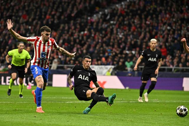 Tottenham Hotspur's Spanish defender #23 Pedro Porro scores his team's first goal during the UEFA Champions League last 16 first leg football match between Club Atletico de Madrid and Tottenham Hotspur at Metropolitano Stadium in Madrid on March 10, 2026. (Photo by Javier SORIANO / AFP)