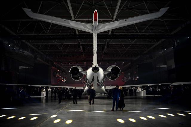 Guests look at Dassault Aviation's new business aircraft the Falcon 10X during its unveiling ceremony  at Dassault headquarters in Bordeaux, south-western France on March 10, 2026. Master of the Rafale fighter jets, French manufacturer Dassault has unveiled the Falcon 10X, its latest private jet. Rarer and more expensive than those of its North American competitors, it is eagerly awaited for its military-grade performance in a growing market. (Photo by Christophe ARCHAMBAULT / AFP)