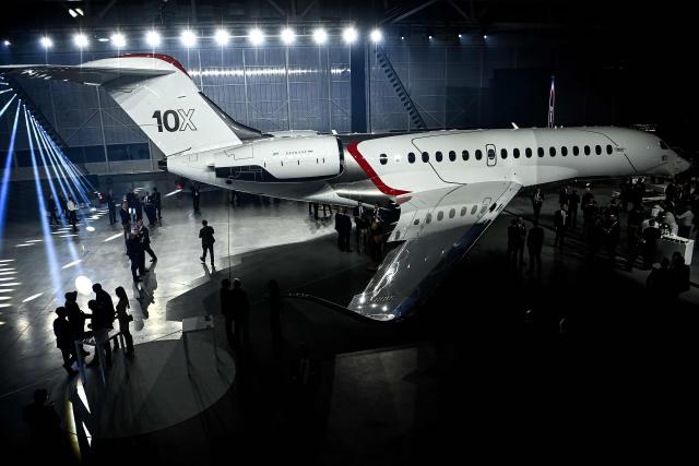 This photograph shows the Dassault Aviation's new business aircraft the Falcon 10X during its unveiling ceremony at Dassault headquarters in Bordeaux, south-western France on March 10, 2026. Master of the Rafale fighter jets, French manufacturer Dassault has unveiled the Falcon 10X, its latest private jet. Rarer and more expensive than those of its North American competitors, it is eagerly awaited for its military-grade performance in a growing market. (Photo by Christophe ARCHAMBAULT / AFP)