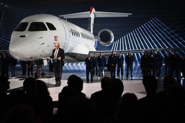 Chairman of Groupe Industriel Marcel Dassault and CEO of Dassault Aviation Eric Trappier delivers a speech next to the Dassault Aviation's new business aircraft the Falcon 10X during its unveiling ceremony at Dassault headquarters in Bordeaux, south-western France on March 10, 2026. Master of the Rafale fighter jets, French manufacturer Dassault has unveiled the Falcon 10X, its latest private jet. Rarer and more expensive than those of its North American competitors, it is eagerly awaited for its military-grade performance in a growing market. (Photo by Christophe ARCHAMBAULT / AFP)