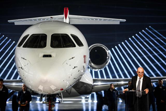 Chairman of Groupe Industriel Marcel Dassault and CEO of Dassault Aviation Eric Trappier delievrs a speech next to the Dassault Aviation's new business aircraft the Falcon 10X during its unveiling ceremony at Dassault headquarters in Bordeaux, south-western France on March 10, 2026. Master of the Rafale fighter jets, French manufacturer Dassault has unveiled the Falcon 10X, its latest private jet. Rarer and more expensive than those of its North American competitors, it is eagerly awaited for its military-grade performance in a growing market. (Photo by Christophe ARCHAMBAULT / AFP)