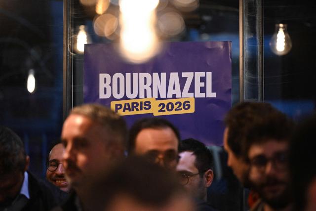 A photo shows a poster during a campaign meeting of Ensemble centre-right party's mayoral candidate for Paris Pierre-Yves Bournazel in a cafe to support Paris mayoral candidate and center-right head of the list for the 14th district Felix de Vidas (not visible) ahead of the Paris municipal elections in Paris on March 10, 2026. (Photo by Martin LELIEVRE / AFP)