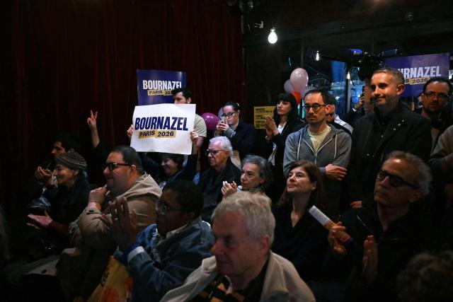 Supporters gather in a cafe as they attend a campaign meeting for Paris mayoral candidate and center-right head of the list for the 14th district Felix de Vidas (not visible) ahead of the Paris municipal electionsm  in Paris on March 10, 2026. (Photo by Martin LELIEVRE / AFP)