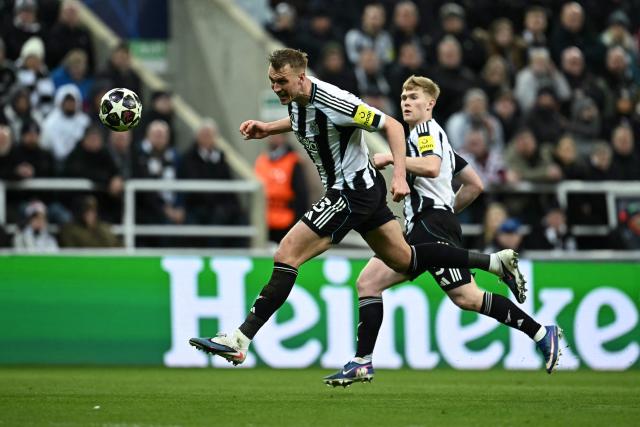 Newcastle United's English defender #33 Dan Burn heads the ball during the UEFA Champion's League, round of 16 football match between Newcastle United and FC Barcelona at St James' Park in Newcastle-upon-Tyne, north east England on March 10, 2026. (Photo by Paul ELLIS / AFP)