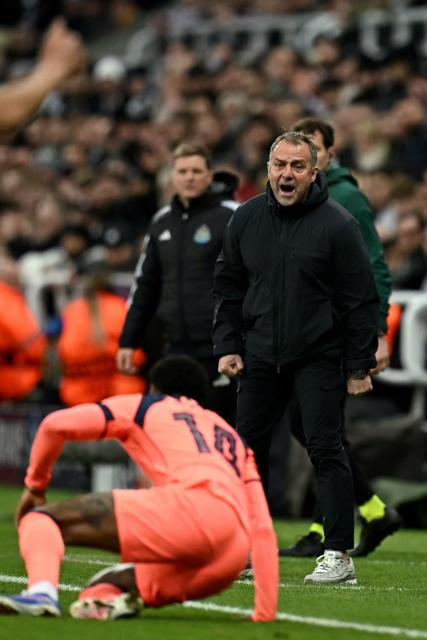 Barcelona's German coach Hans-Dieter Flick shouts instructions to the players from the touchline during the UEFA Champion's League, round of 16 football match between Newcastle United and FC Barcelona at St James' Park in Newcastle-upon-Tyne, north east England on March 10, 2026. (Photo by Paul ELLIS / AFP)