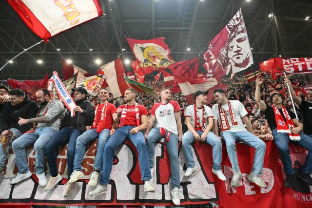 Bayern Munich supporters celebrate after winning 0-6 the UEFA Champions League last 16, first leg football match between Atalanta and Bayern Munich at the Gewiss stadium in Bergamo, on March 10, 2026. (Photo by Alberto PIZZOLI / AFP)