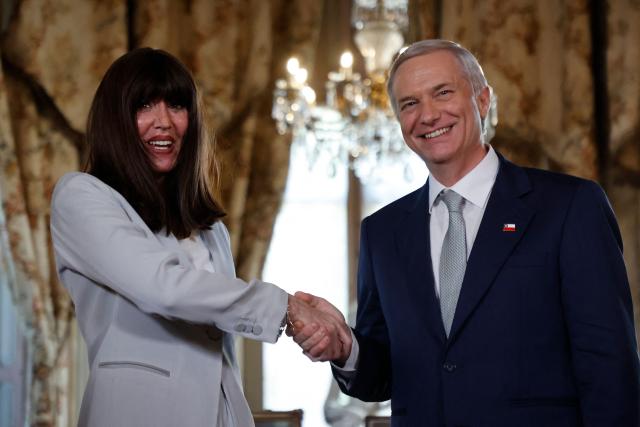 Chile's President-elect Jose Antonio Kast (R) shakes hands with Italy's Minister of University and Research, Anna Maria Bernini, during a meeting at the Cousino Palace in Santiago on March 10, 2026, ahead of the presidential inauguration. (Photo by Raul BRAVO / AFP)