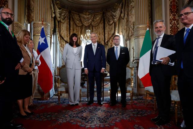 Chile's President-elect Jose Antonio Kast (C) poses with Italy's Minister of University and Research, Anna Maria Bernini (L), during a meeting at the Cousino Palace in Santiago on March 10, 2026, ahead of the presidential inauguration. (Photo by Raul BRAVO / AFP)