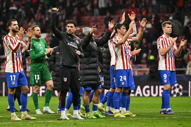 Atletico Madrid players celebrate their victory at the end of the UEFA Champions League last 16 first leg football match between Club Atletico de Madrid and Tottenham Hotspur at Metropolitano Stadium in Madrid on March 10, 2026. (Photo by Javier SORIANO / AFP)
