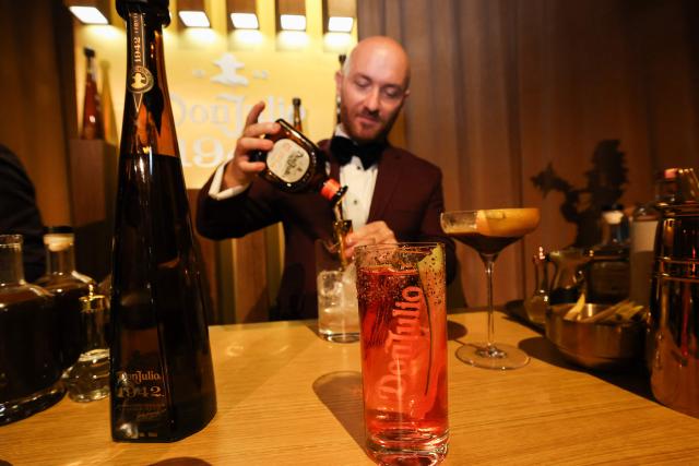 Lorenzo Antinori prepares a cocktail with Don Julio tequila at the 98th Oscars Governors Ball preview at the Ray Dolby Ballroom in Hollywood, California, on March 10, 2026. Austrian Chef Wolfgang Puck unveiled his menu for the Academy's official post Oscars celebration. (Photo by VALERIE MACON / AFP)