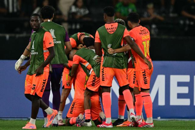 Barcelona players celebrate after scoring the opening goal during the Copa Libertadores phase three second-leg football match between Brazil's Botafogo and Ecuador's Barcelona at the Nilton Santos Stadium in Rio de Janeiro, Brazil on March 10, 2026. (Photo by Pablo PORCIUNCULA / AFP)