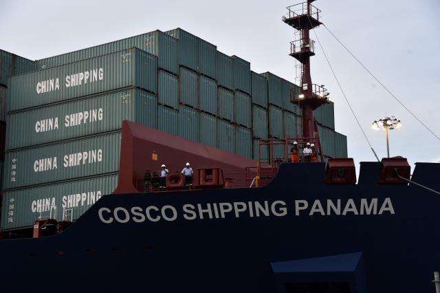 (FILES) Chinese-chartered merchant ship Cosco Shipping Panama crosses the new Cocoli Locks during the inauguration of the Panama Canal expansion in Panama City on June 26, 2016. Chinese shipping company Cosco announced on March 10, 2026, that it will cease operations at a port in the Panama Canal, whose concession was revoked by the Panamanian courts from Hong Kong-based CK Hutchison Holdings, according to an internal memo released by local media. (Photo by RODRIGO ARANGUA / AFP)