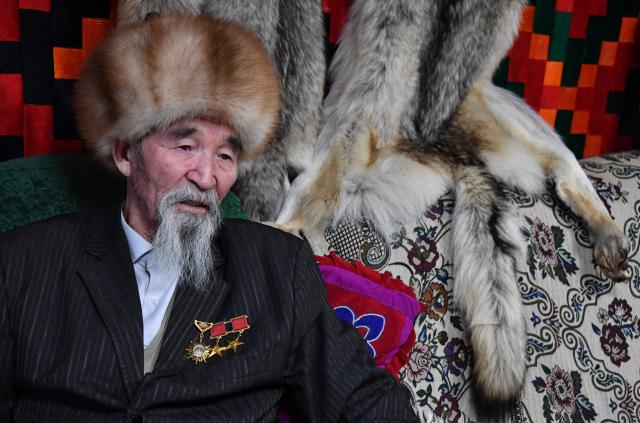 Tashtanbek, 88, patriarch of the Akmatov family of white yaks breeders, talks to AFP reporters in his house in the mountainous Kyrgyz village of Kara-Saz on February 2, 2026. (Photo by Vyacheslav OSELEDKO / AFP)
