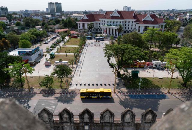 A Bus Rapid Transit (BRT) vehicle is seen from the top of Patuxai, also known as the Victory Monument, in Vientiane on March 10, 2026, as the public transportation system resumes in the Lao capital. (Photo by AFP)