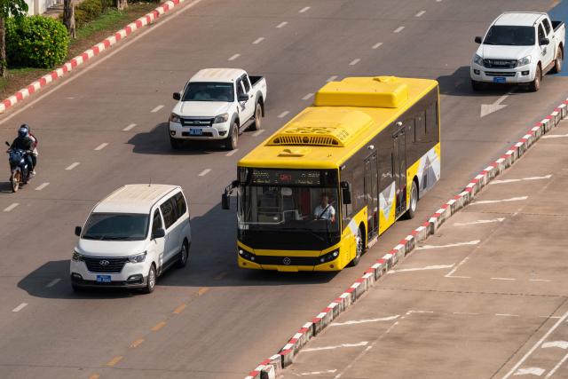 A Bus Rapid Transit (BRT) vehicle is seen from the top of Patuxai, also known as the Victory Monument, in Vientiane on March 10, 2026, as the public transportation system resumes in the Lao capital. (Photo by AFP)