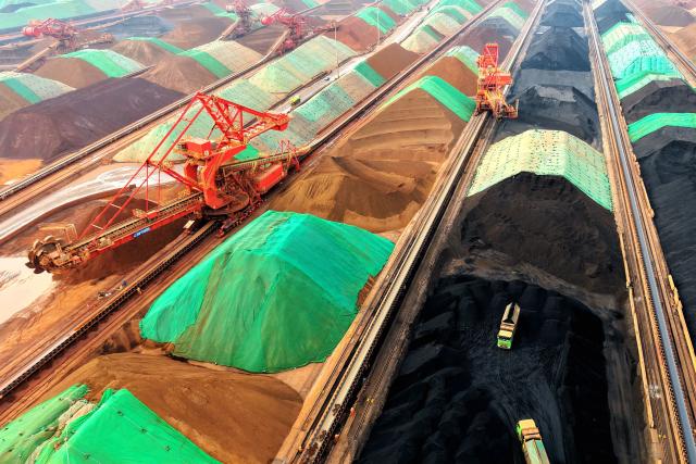 This picture shows a general view of an iron ore terminal at a port in Qingdao, in China’s eastern Shandong province on March 11, 2026. (Photo by CN-STR / AFP) / China OUT