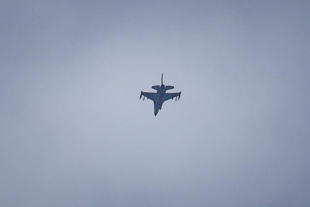 A United Arab Emirates Air Force F-16 fighter jet flies over Dubai on March 11, 2026. The Gulf countries have long been seen as islands of stability in the Middle East, but the war in the region could threaten their prosperity, analysts said, pointing to risks to their revenues and reputations as business havens. (Photo by AFP) / Attention editors: AFP covers the war in the Middle East through its extensive regional network, including bureaus in Tehran, Jerusalem, and several neighboring countries. Since the start of the conflict, journalists have been working under increasingly restrictive conditions. Authorities in several countries have limited reporters' movements, photo and live video coverage from sensitive locations. Some governments and armed groups have banned images of missile or drone strikes and other security-related sites. / 