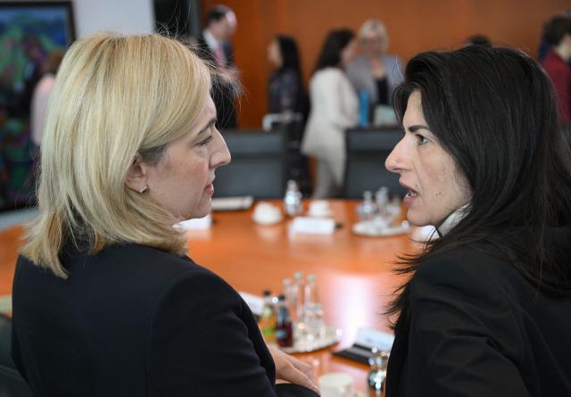 German Health Minister Nina Warken (L) and German Minister of State for Europe in the Foreign Office Serap Gueler talk prior to  the weekly cabinet meeting, on March 11, 2026 at the Chancellery in Berlin. (Photo by RALF HIRSCHBERGER / AFP)